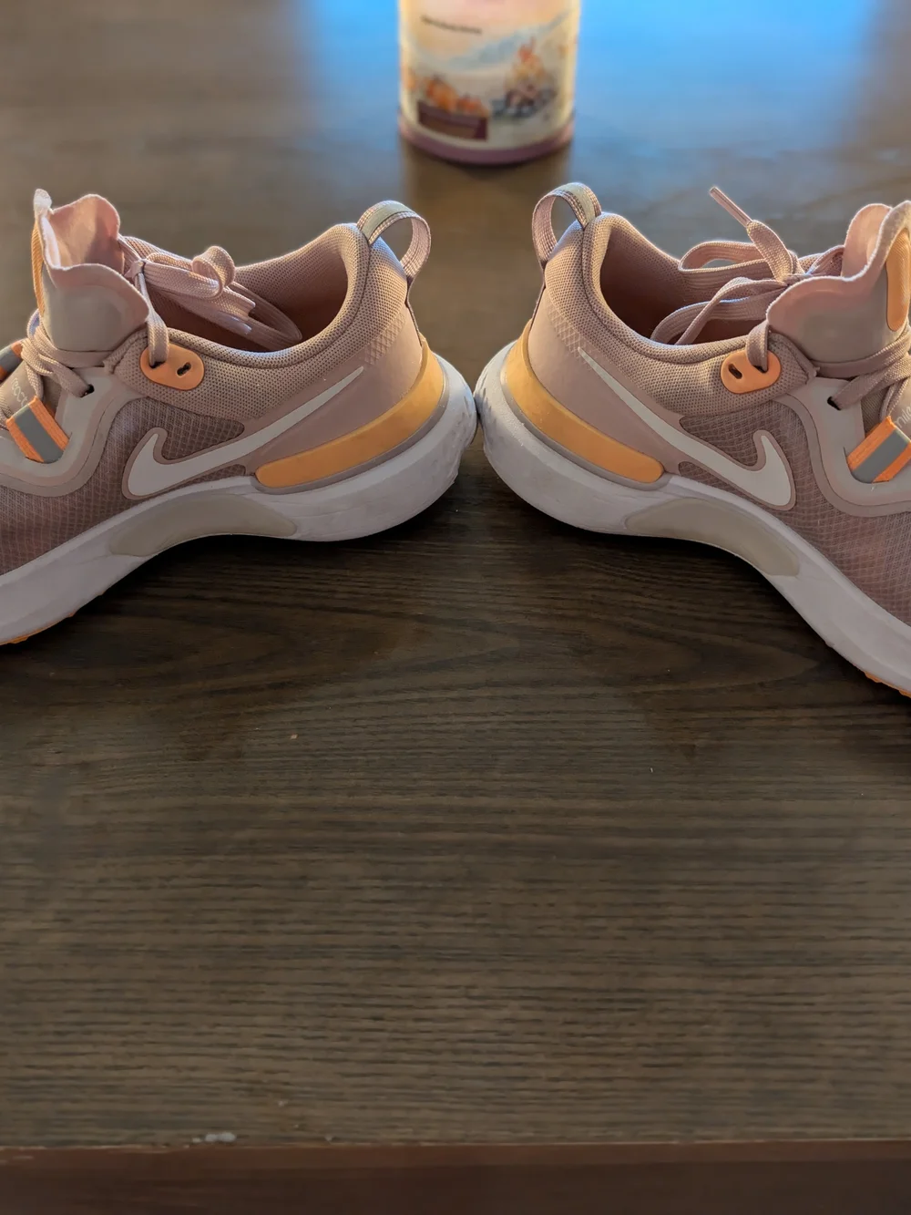 Nike Women’s React Running Shoes in Peach with Orange Highlights